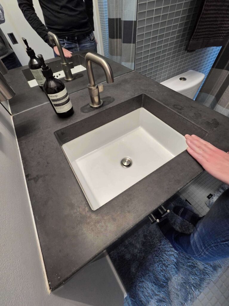 Before: concrete vanity top in Washington, DC, photographed by Rose Restoration before the work