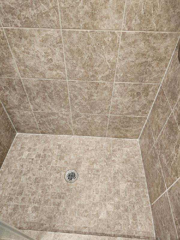 Stone shower floor with drain, Rose Restoration project
