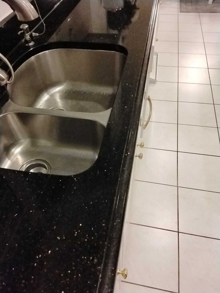 After: the same cracked granite at a kitchen sink in Silver Spring, MD after Rose Restoration's work