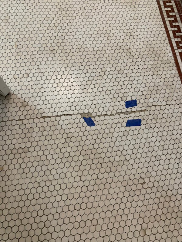 Hexagonal tile floor during grout work, Rose Restoration project