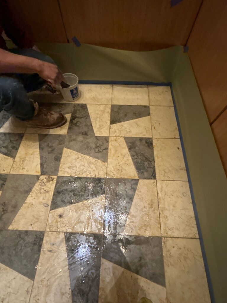 Before: inlaid stone floor in Washington, DC, photographed by Rose Restoration before the work