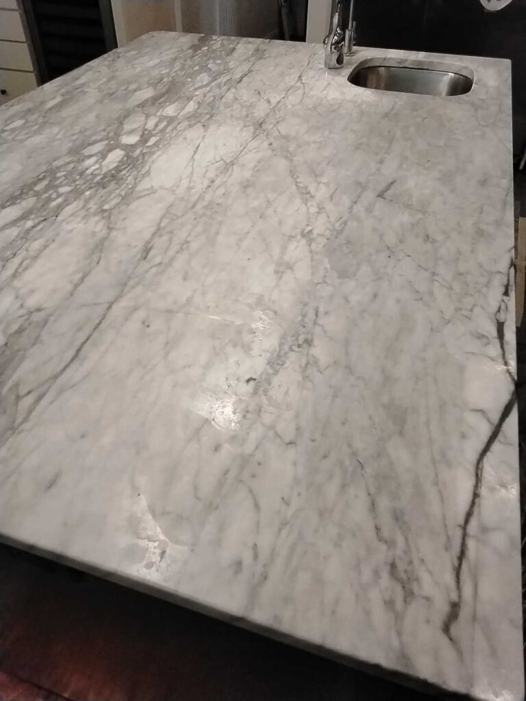 Before: kitchen island countertop with a crack in Arlington, VA, photographed by Rose Restoration before the work