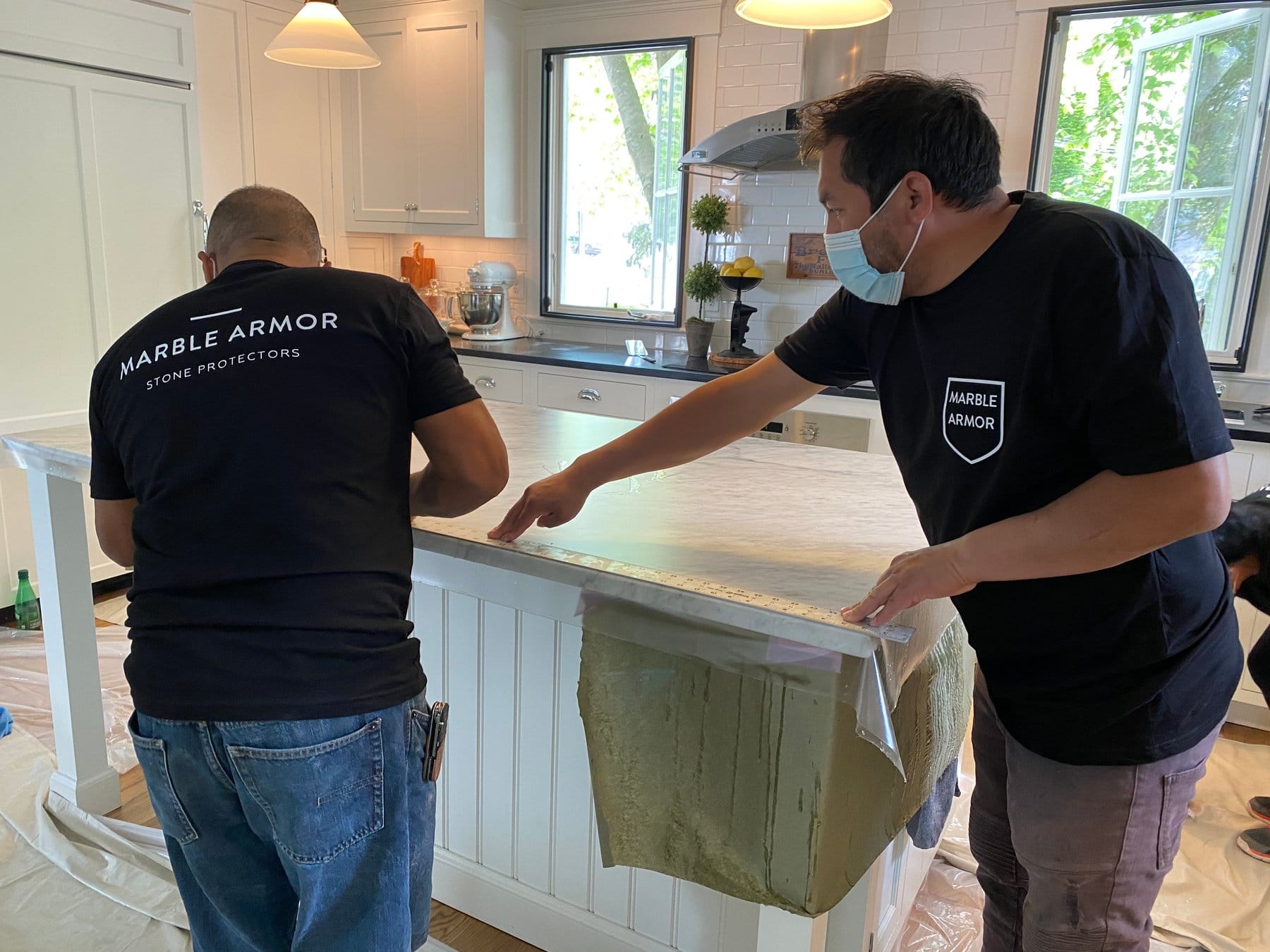 Marble Armor crew starting a countertop install