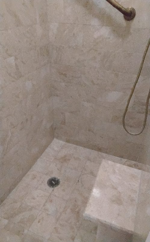 Marble shower with bench in a Washington, DC home