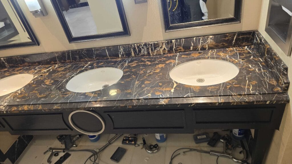 Marble countertop with three sinks from a Rose hotel job in Oxon Hill, MD