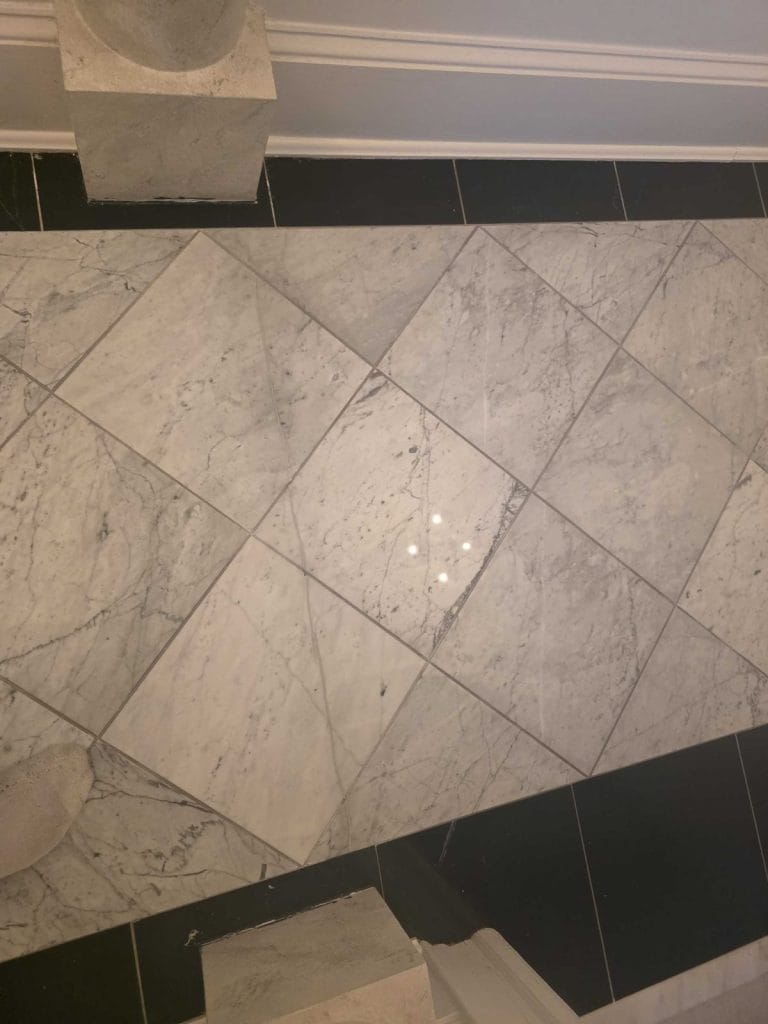 Polished marble floor after restoration in a Washington, DC apartment