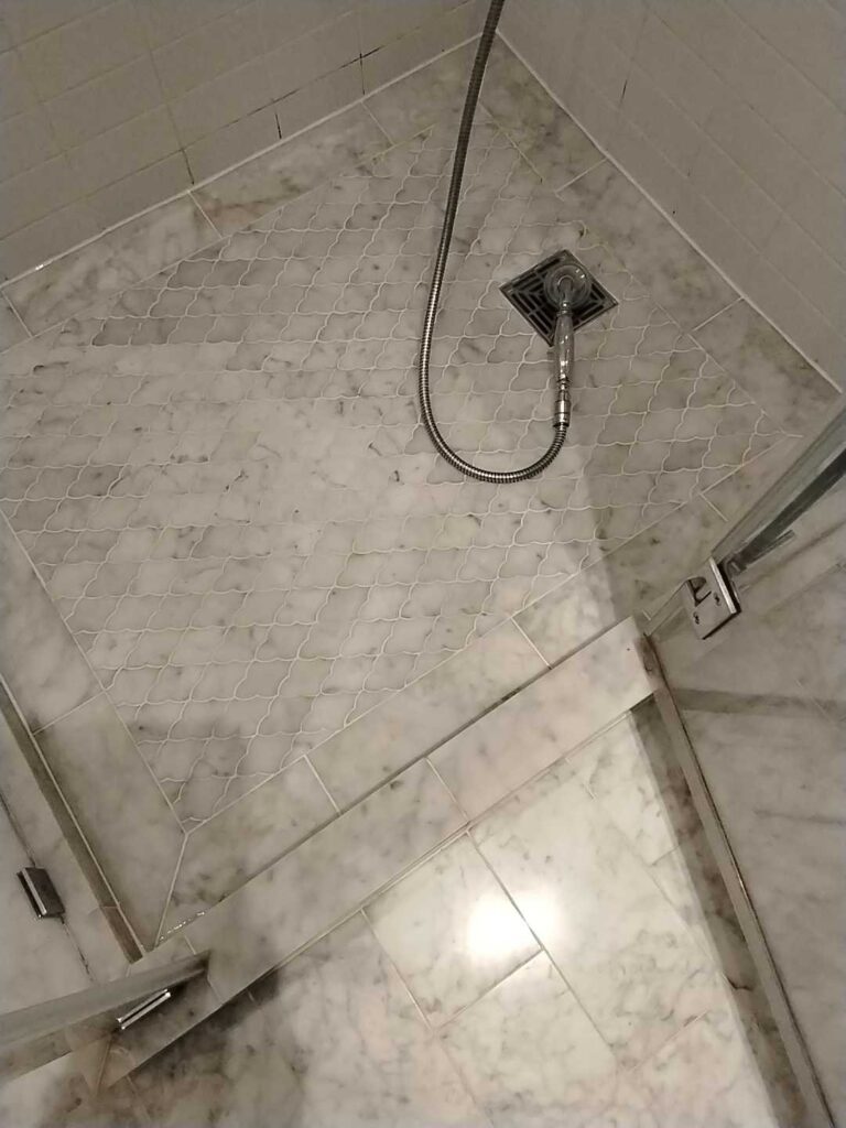 Marble shower floor with patterned tiles, Rose Restoration project