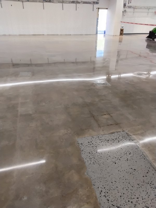 Patched area polished into the slab, Lidl Falls Church, 2026