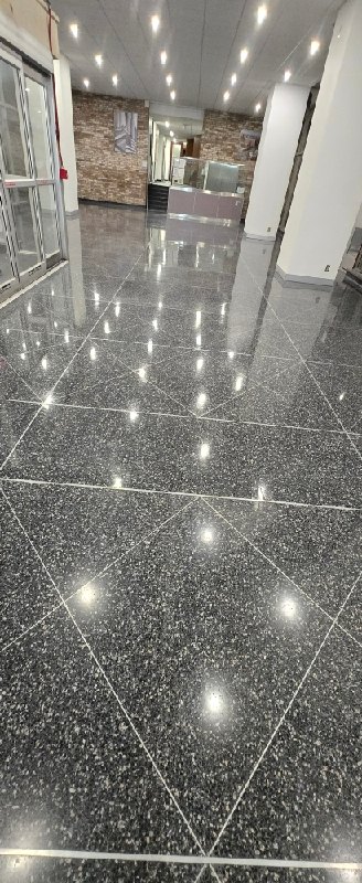Polished black stone floor at a federal research campus, Rose Restoration project