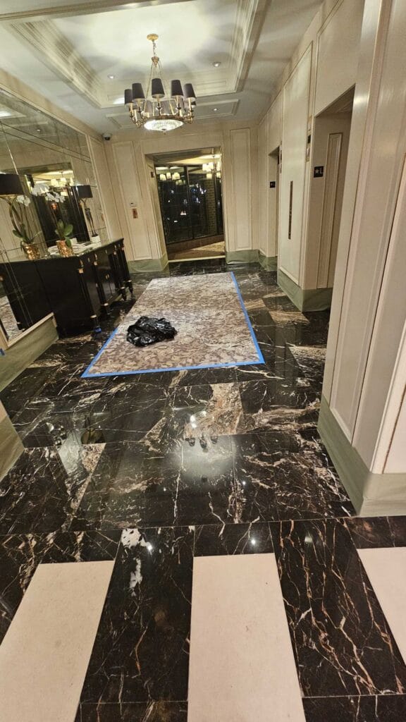 Polished marble floor with patterned tiles from a Rose hotel job in Washington, DC