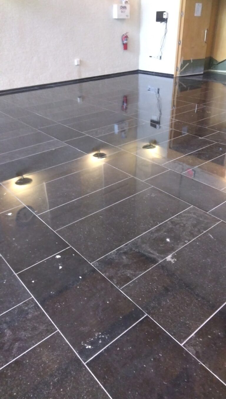 Polished stone floor with recessed lights in an embassy, Rose Restoration project