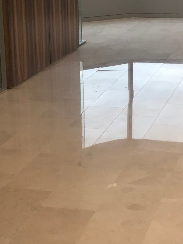 Polished stone floor with reflections, Rose Restoration project