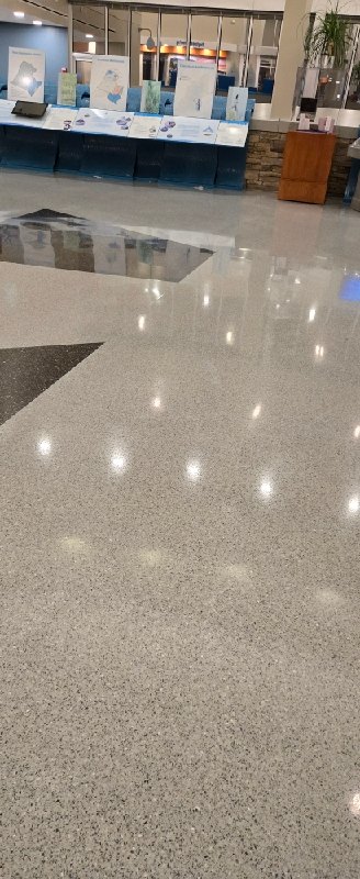 Polished stone floor with reflective surface, Rose Restoration project