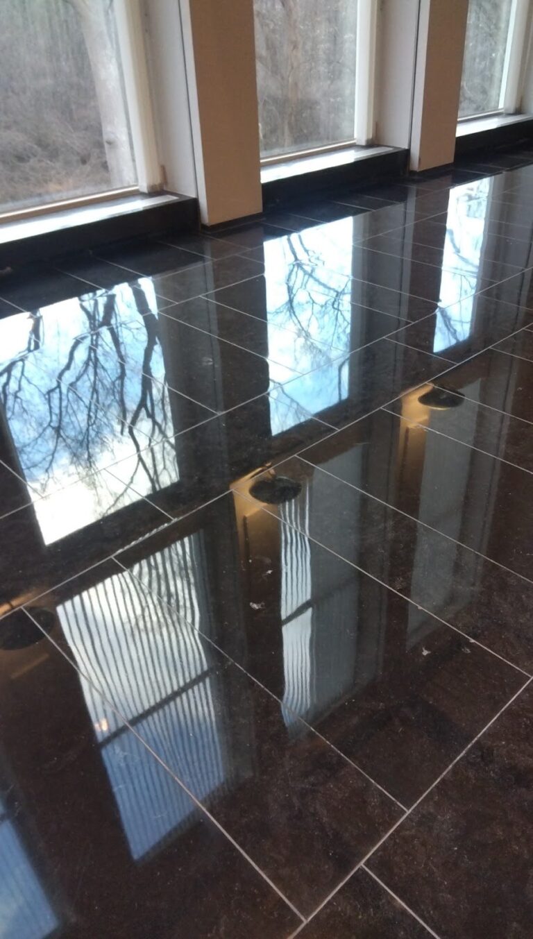 Polished stone floor with window reflections in an embassy, Rose Restoration project