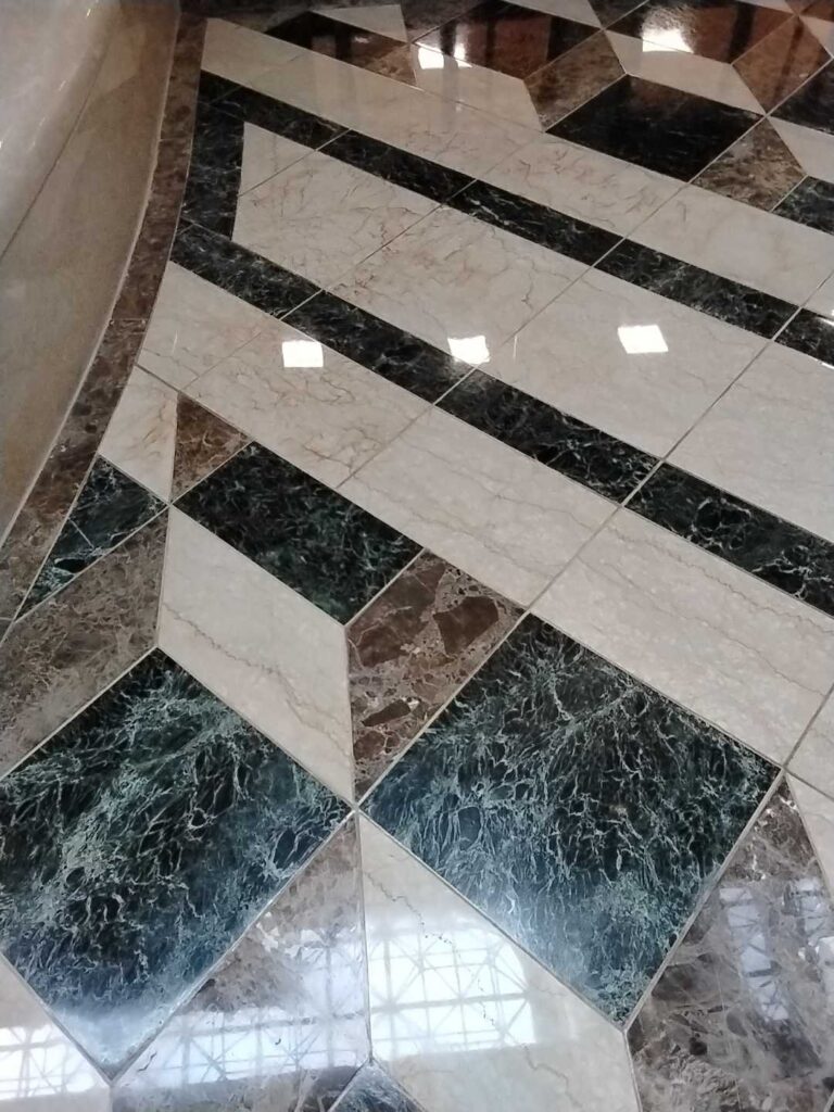 After: the same inlaid stone atrium floor in Washington, DC after Rose Restoration's work