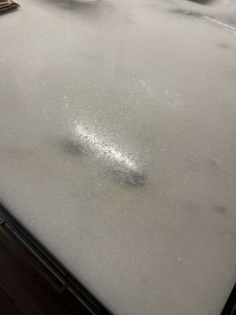 Stone countertop with water stain, Rose Restoration project