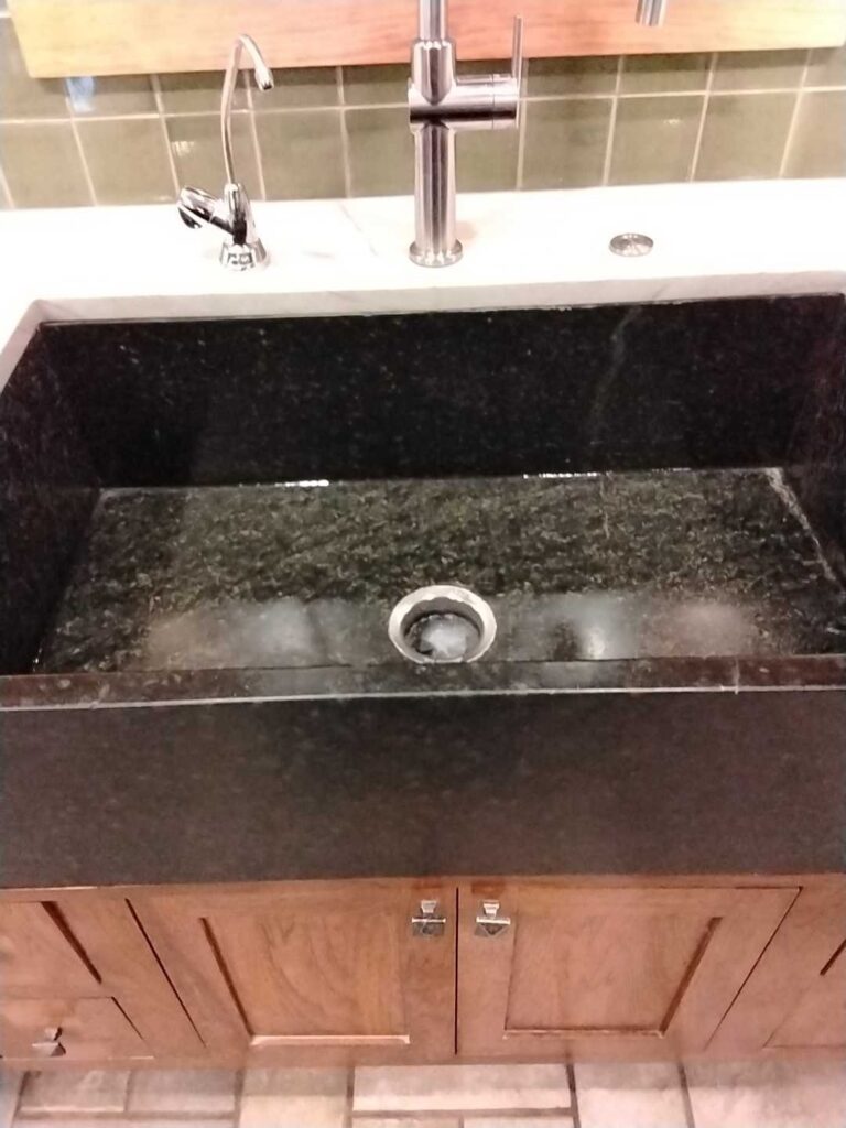 After: the same stone farmhouse sink in Great Falls, VA after Rose Restoration's work
