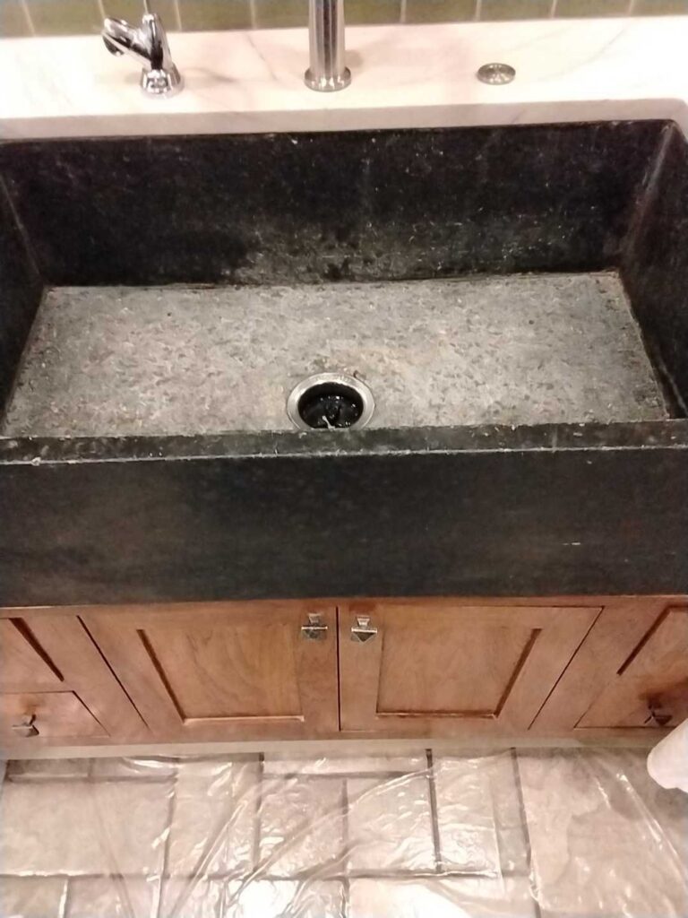 Before: stone farmhouse sink in Great Falls, VA, photographed by Rose Restoration before the work