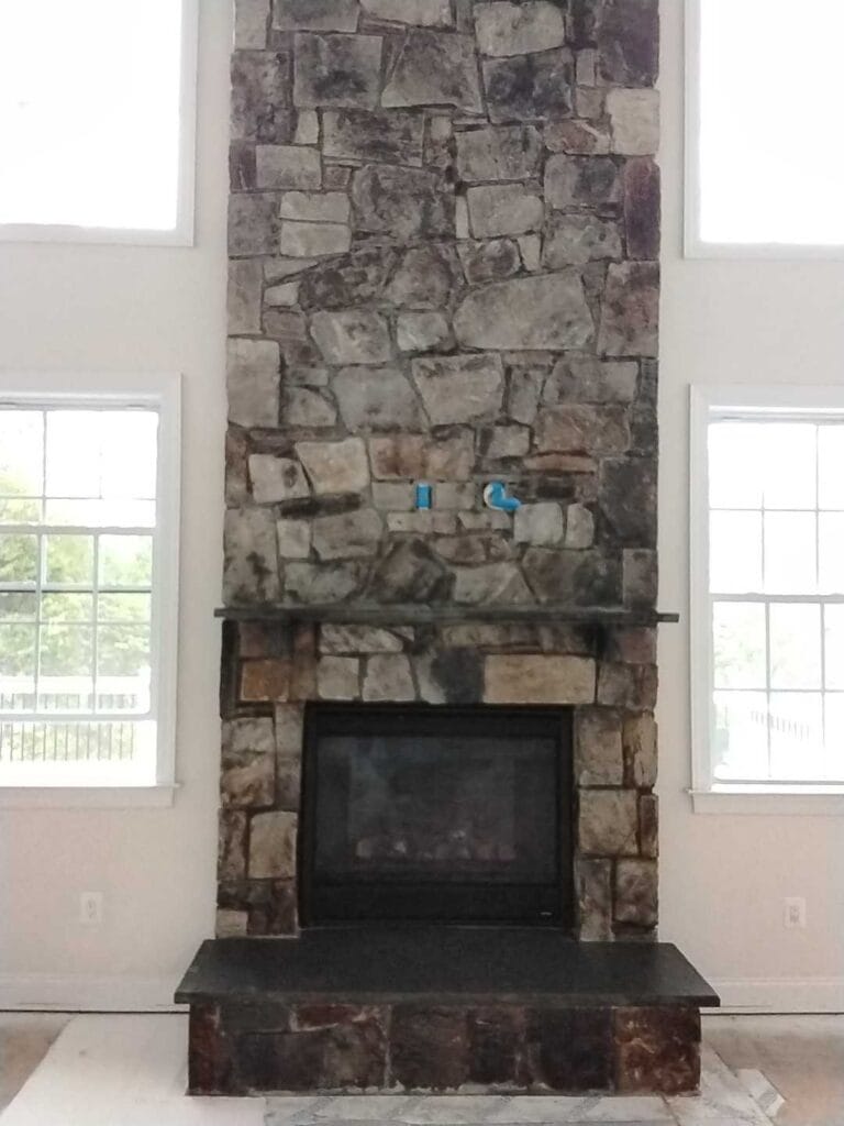 Stone fireplace with mantel from a Rose job in Haymarket, VA