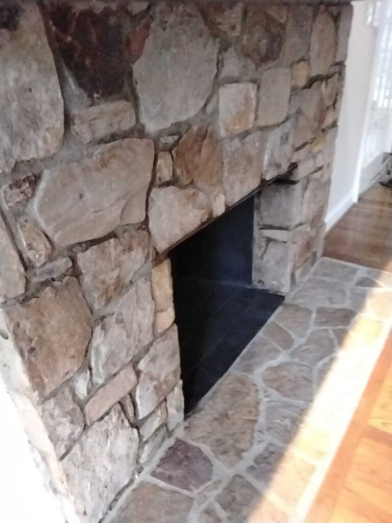 Stone fireplace with stone hearth from a Rose job in Alexandria, VA