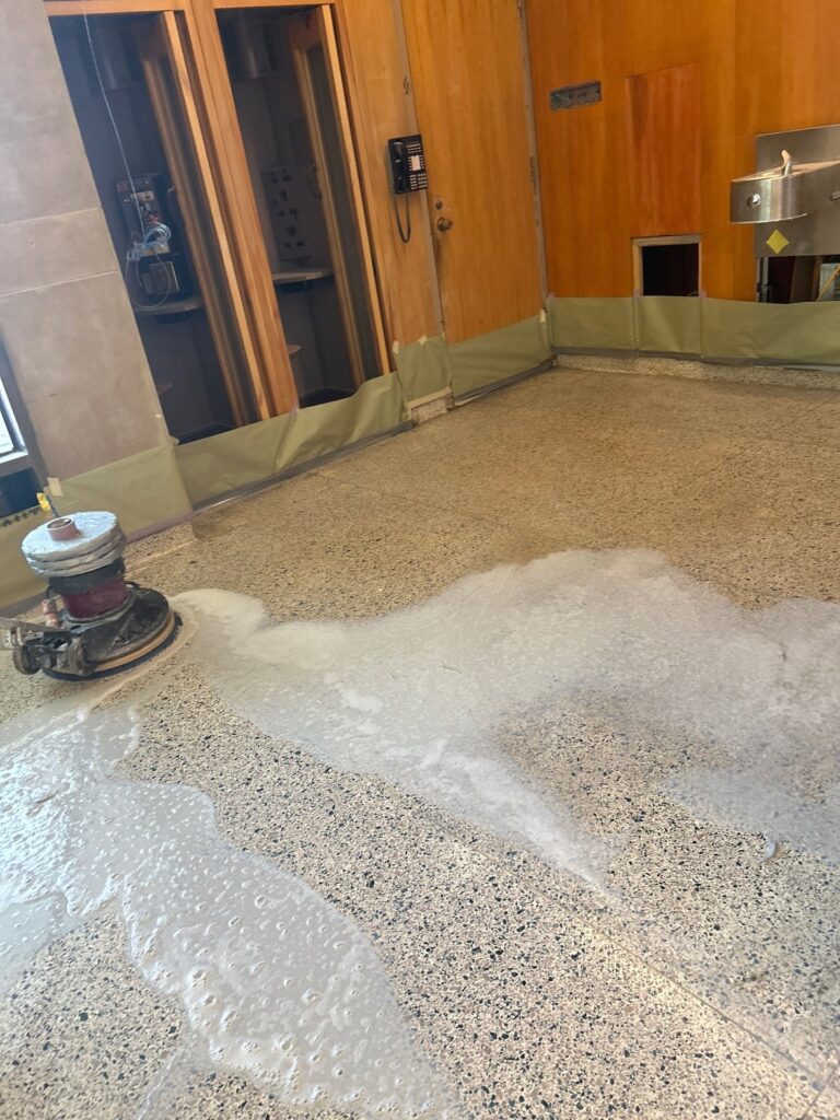 Stone floor during cleaning at a federal research campus, Rose Restoration project