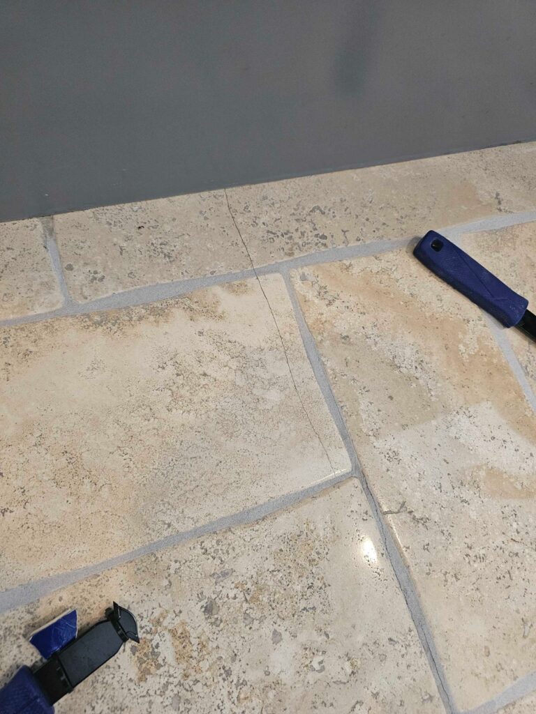 Stone floor with gray grout, Rose Restoration project