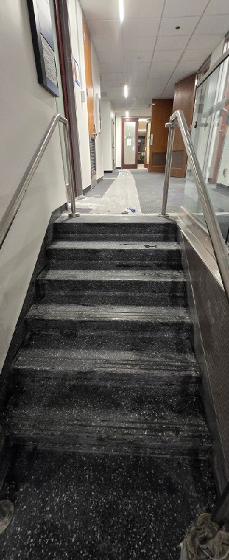 Stone staircase with metal railings at a federal research campus, Rose Restoration project