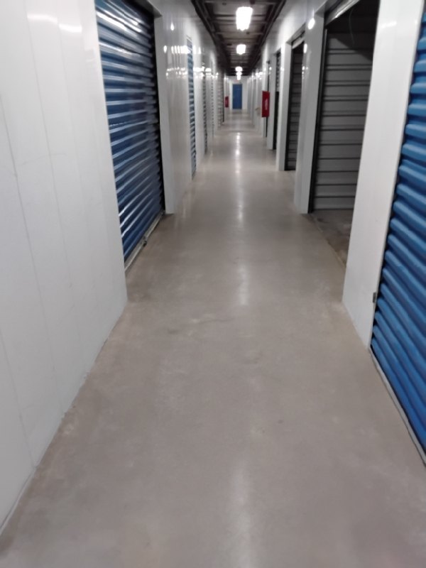 After: the same concrete corridor in a storage facility in Dumfries, VA after Rose Restoration's work