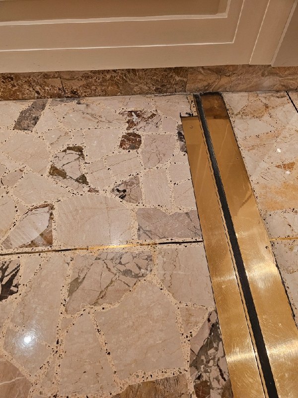Before: condominium lobby terrazzo in Washington, DC, photographed by Rose Restoration before the work
