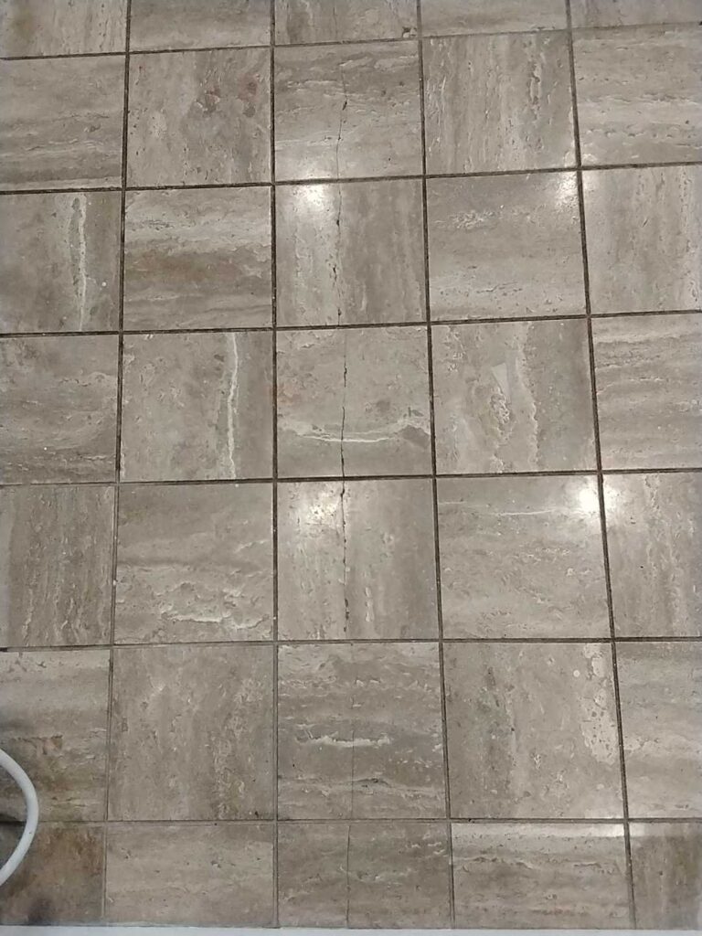 Before: travertine floor in Dickerson, MD, photographed by Rose Restoration before the work