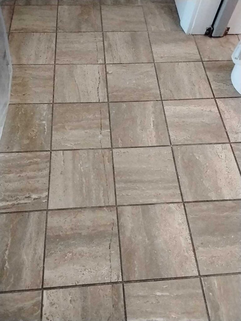 Before: travertine floor in Dickerson, MD, photographed by Rose Restoration before the work