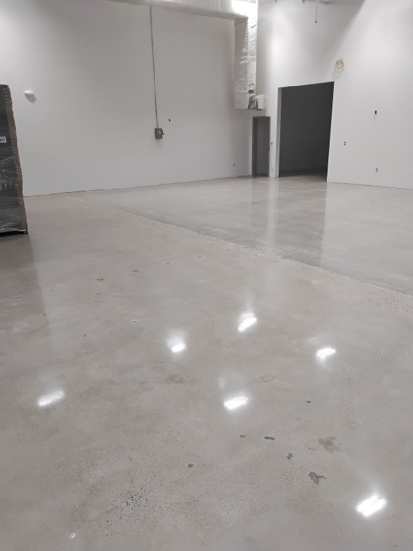 After: the same warehouse concrete floor in Chantilly, VA after Rose Restoration's work