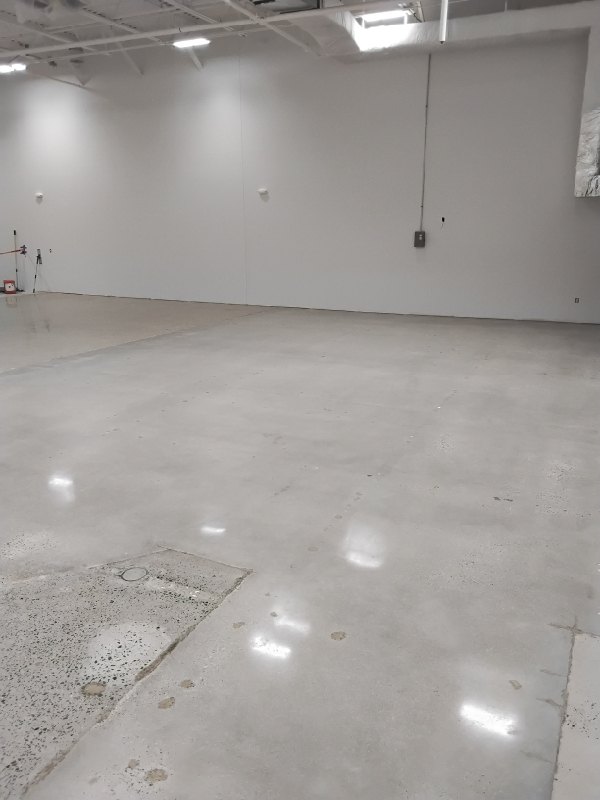 Before: warehouse concrete floor in Chantilly, VA, photographed by Rose Restoration before the work