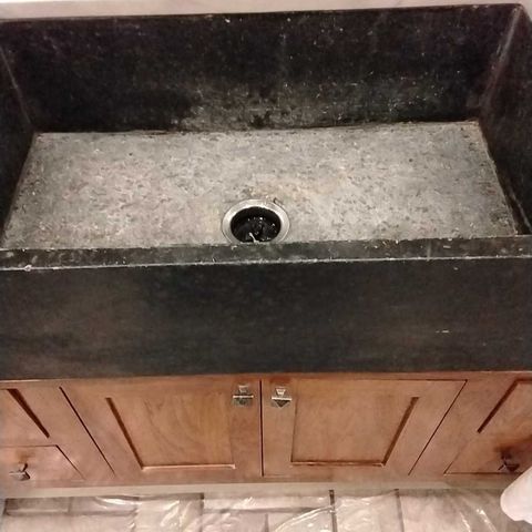 Stone farmhouse sink before restoration