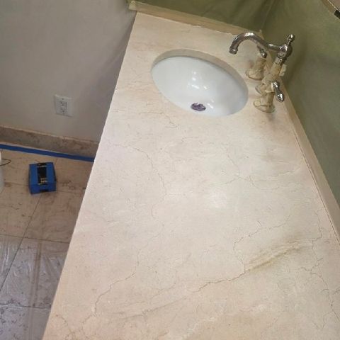 Travertine vanity top before restoration